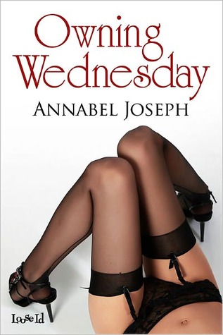 the bent legs of a woman lying on her back, wearing black garters and stockings.
