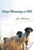 Dogs Running a Hill