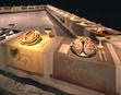 An installation view of wing three, featuring Virginia Woolf and Georgia O'Keeffe place-settings from 'The Dinner Party' © Judy Chicago, 1979.

(Embroidery on linen and china paint on porcelain)


