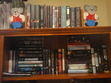So this is what I call my 'new' bookshelf. I got it this year, since there were books ALL over my floor :/

TOP: These are sitting on top of the shelf. They are all borrowed books (Mostly Ros', haha)

SHELF ONE: This is *mainly* the books I brought back from the USA. Most of them are hardcovers (obviously). The stacks make another appearance, although they have maily paperbacks in them.
Sidenote: Nic, notice anything familiar in there? What about you Braiden?
Those random envelopes have swag in them.

