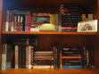 More on the 'new' shelf...

SHELF TWO: More paperbacks, a tea cup and a photo with the best friend <3
Oh, and some random cookbooks. :P
The gap is because a friend has my copy of The Iron King.

SHELF THREE: Quite a few taller paperbacks and you can see some of the swap books I've received if you know what to look for...
There's a gap here since Delirium is out with a friend.
