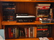 And the last two shelves...

SHELF FOUR: On the left are DNF books, books to swap or books we are unable to review as we don't have the first in the series.
In the middle there is my beloved Wise Man's Fear which is too big to fit nicely anywhere else at the moment and a bound manuscript of 'Winter's Shadow' (I think...) for review.
On the right are more review books that need to be split between Ros and I, or that are mine to review.

SHELF FIVE: On the left are random non fiction books, a book of signatures from my classmates in my final year of school and the complete works of William Shakespeare.
On the right (separated by that tiny green divider, if you can see it...) are books that either Ros has reviewed and I need to read, books that we have both read or books that need to be reviewed. There are more in that stack, but they were blocked out by the shelf.
There's also some more swag in that envelope.

...
I also have a pile of books on my desk that I need to write reviews up for. But I didn't want to show you my mega messy desk... so yeah. There you go. :)
There are more books on my bedside table too... but ditto with the mess...