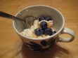 To quote Alana, "I am a cheese maker!" Here's a photo of my ricotta, topped with fresh blueberries, honey, and a touch of cinnamon. I served it to my partner and another friend for dessert last night. Hooray!