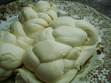 My finished beauties! I was first introduced to mozzarella at an Italian Deli in New Jersey. The one pound cheeses came in a nice plump ball. But the two pound cheeses were braided. Just beautiful. And so much fun to pull them apart and eat the strings of fresh creamy cheese. I've never seen it braided anywhere since. So I decided to try it. I'm not sure what they did with the ends, and I didn't master that too elegantly on the first try, but I think it has some promise.